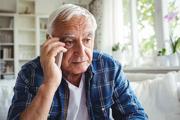 A man speaks with a credit counsellor over the phone