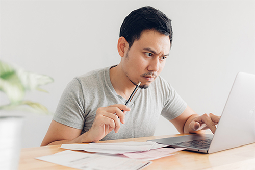 credit-counselling A person figuring out the fastest way to get out of debt.